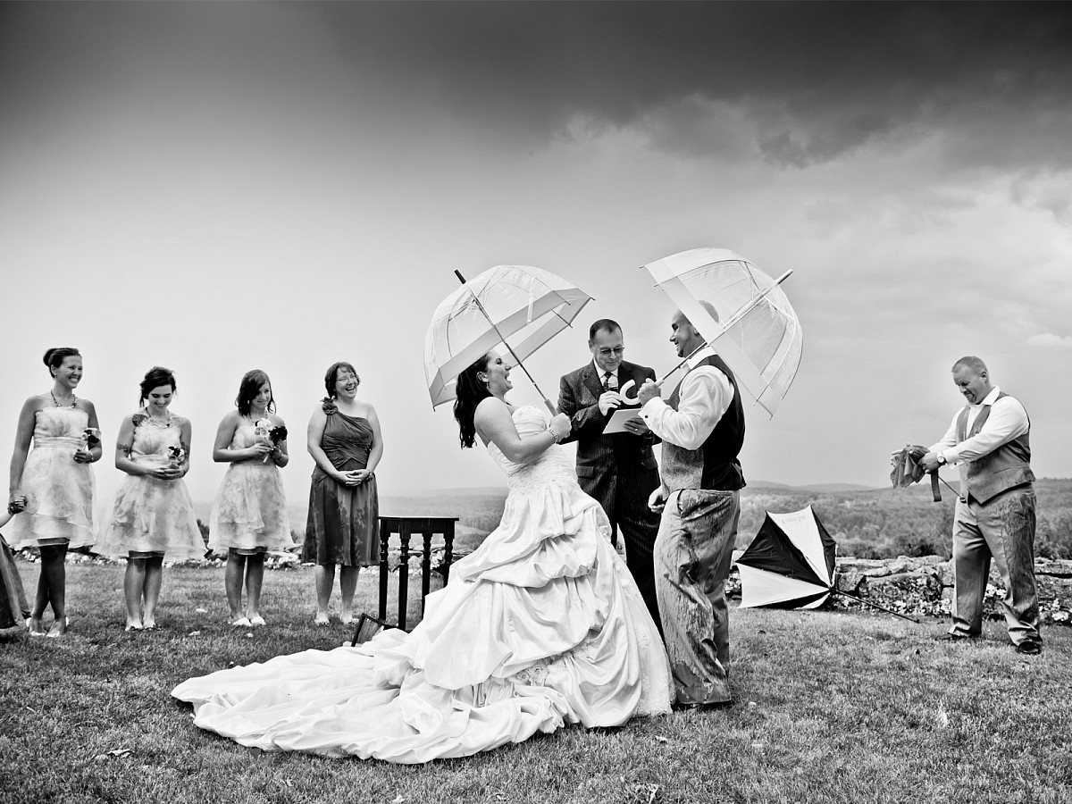 Weddings-Rain-Ceremony-Umbrellas-Outdoor-Downpour.jpg